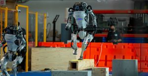 Musk pushes for Tesla payday amid job cuts; Atlas robot retired