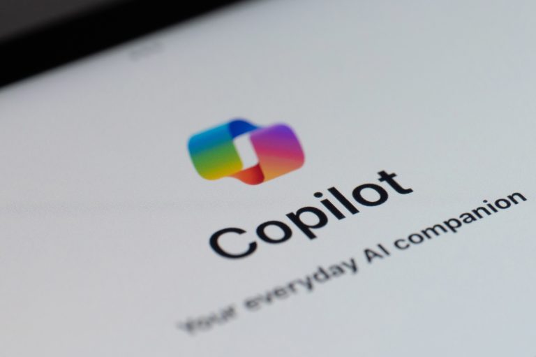 Logo of Microsoft Copilot app on a mobile device screen, showing the colorful Copilot icon above the word “Copilot” and the tagline “Your everyday AI companion” on a white background.
